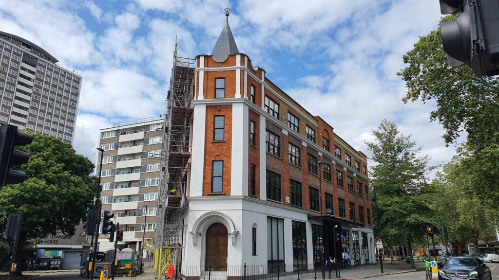 St Johns street building with part scaffolding removed, corner of street view