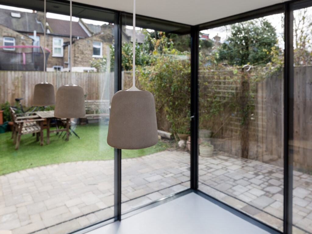 Hanging lights with a view of the garden behind
